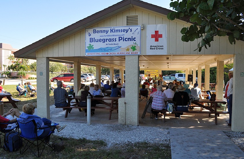 Many people sat around and underneath the pavilion out at Turtle Beach in order to enjoy the musicians that played during Benny Kimsey's Bluegrass Picnic on Saturday afternoon.