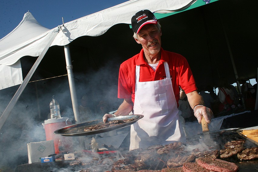 David Lax perfected his burger-grilling technique at the Ruth's Chris Steak House booth.