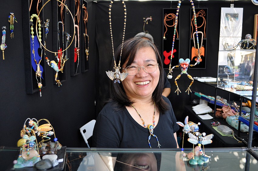 Cynthia Chuang smiles from behind the counter of Jewelry10, Sunday, Nov. 13 out on St. Armands Circle.