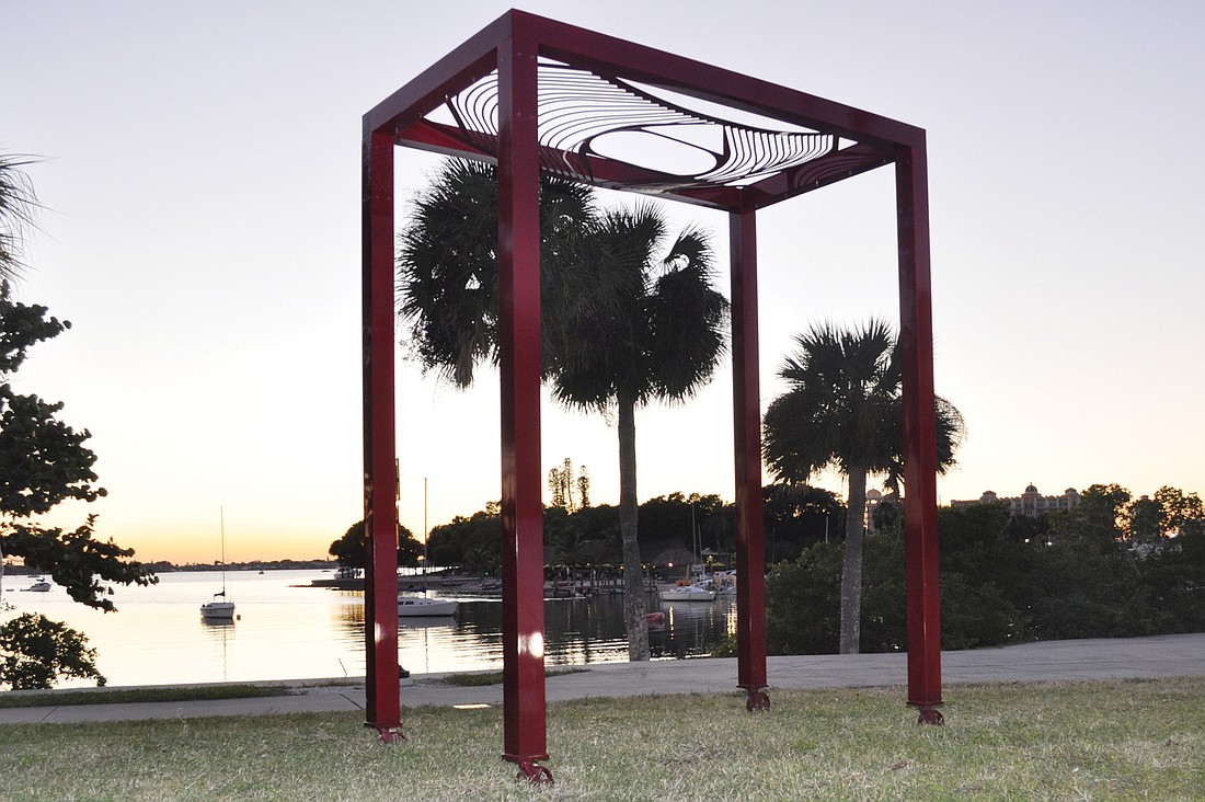 Verina Baxter's "Big Red Tumkin" could be viewed as a huge picture frame for the Sarasota bayfront at sunset.