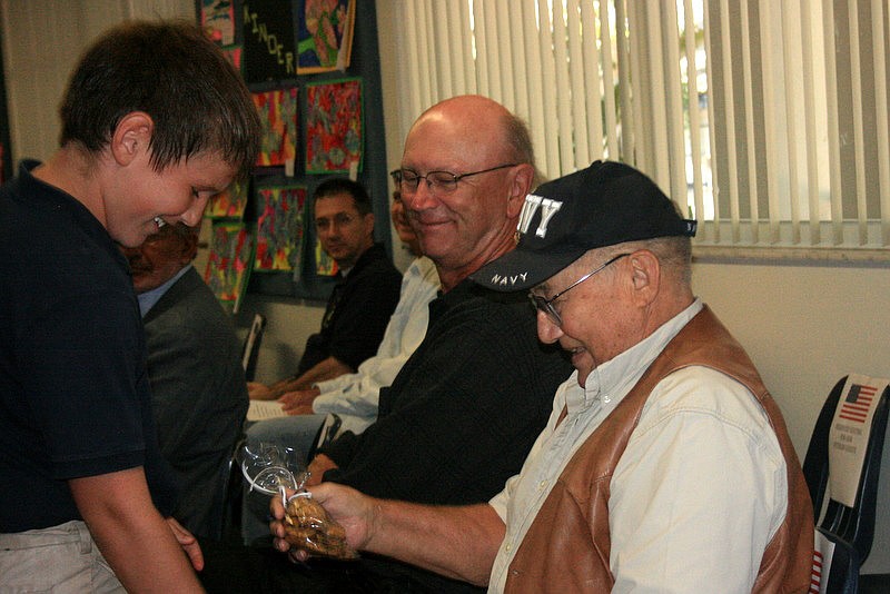 Dylan Davis presenting to his grandfather, Jack Atwater courtesy of Vicki Hosmer.