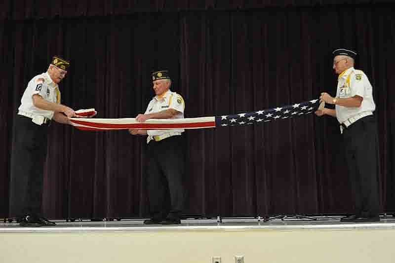 VFW Post 10141 members demonstrated how to fold the American flag.