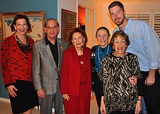 Sue Jacobson, Bert Fivelson, Sarah Elbert, Ursula Pearson, Mimi Edlin and Grant Jones pose together, Friday, Nov. 18, at Edlinâ€™s home at the Sarasota Bay Club.