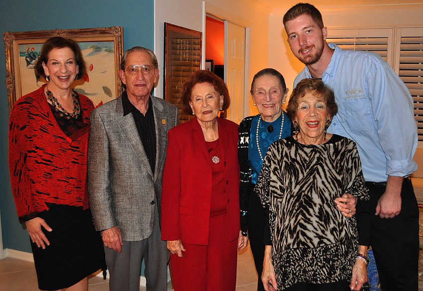 Sue Jacobson, Bert Fivelson, Sarah Elbert, Ursula Pearson, Mimi Edlin and Grant Jones pose together, Friday, Nov. 18, at Edlinâ€™s home at the Sarasota Bay Club.