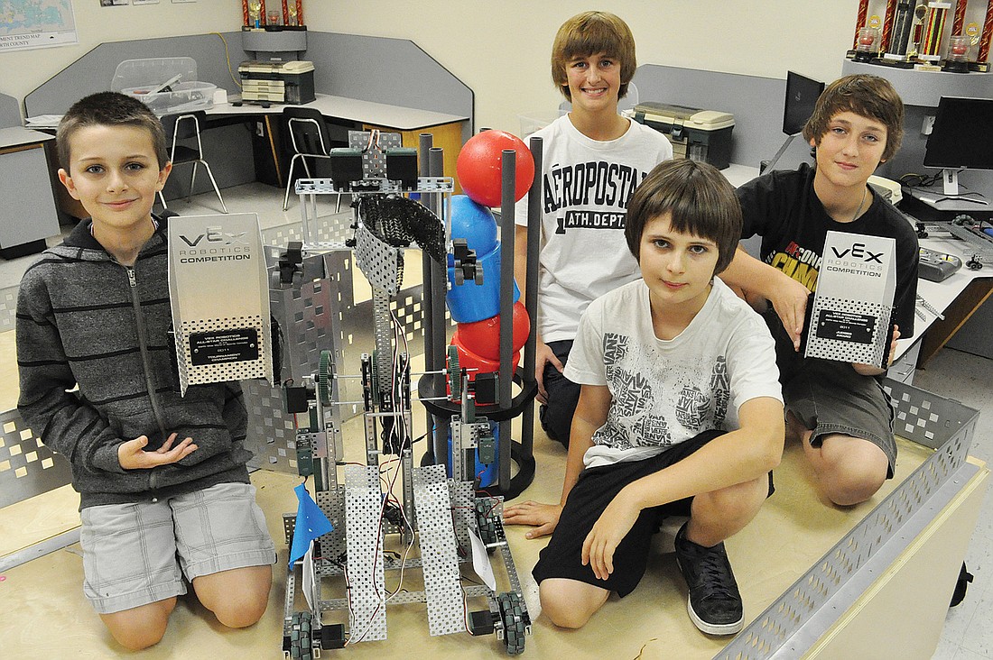 Haile Middle School students Tyler Whitlock and Parker Whitlock, front, and Taylor Lewis and C.J. Cooper recently won awards at the 2011 VEX Robotics All-Star Challenge.