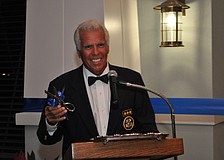 Commodore Bob Baime prepares to cut the ribbon