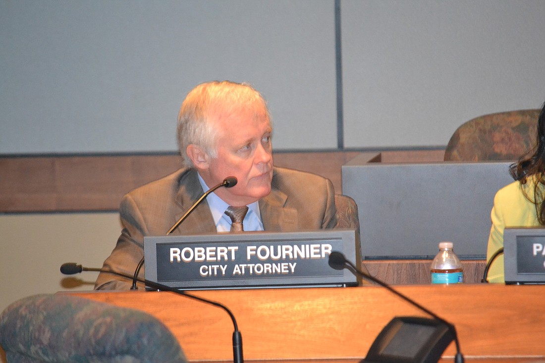 City attorney Bob Fournier told commissioners its three commission districts must be redrawn Monday.