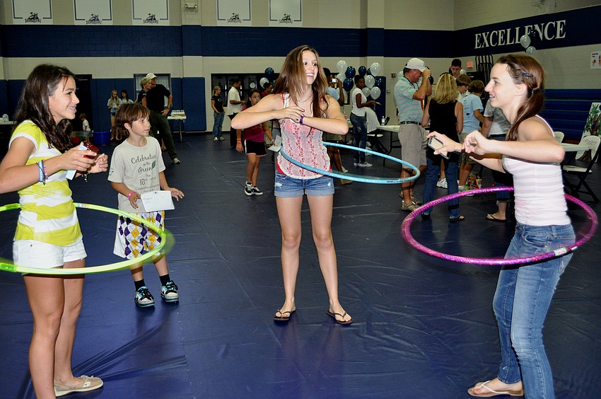 Eighth-graders Miller Condrack, Sydney Koffman and Giana Deramo had a blast hula hooping.