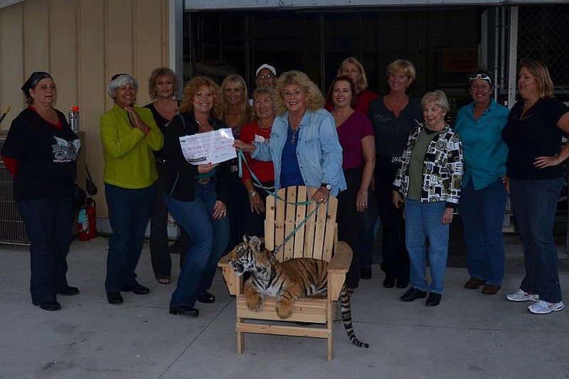 Ladies in Diva Angels donated proceeds from a recent poker run to Big Cat Habitat of Sarasota. Photo courtesy of Donna Defant.