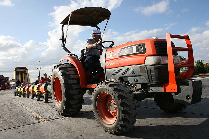 Children enjoyed a tractor-pulled train ride through the groves.