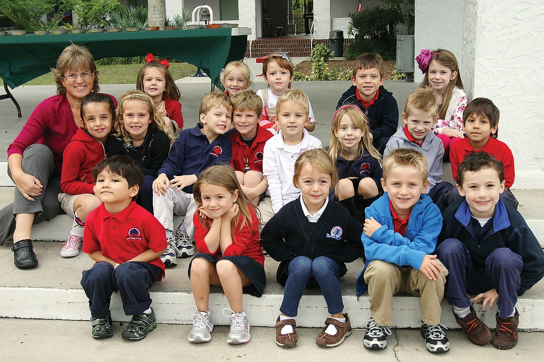 Susan Nations' kindergarten class poses, Wednesday, Nov. 30, in the courtyard at Southside Elementary.