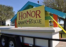 Workers from Florida Sign Co. today are busy erecting a new monument sign for Honor Animal Rescue at its Lorraine Road ranch.