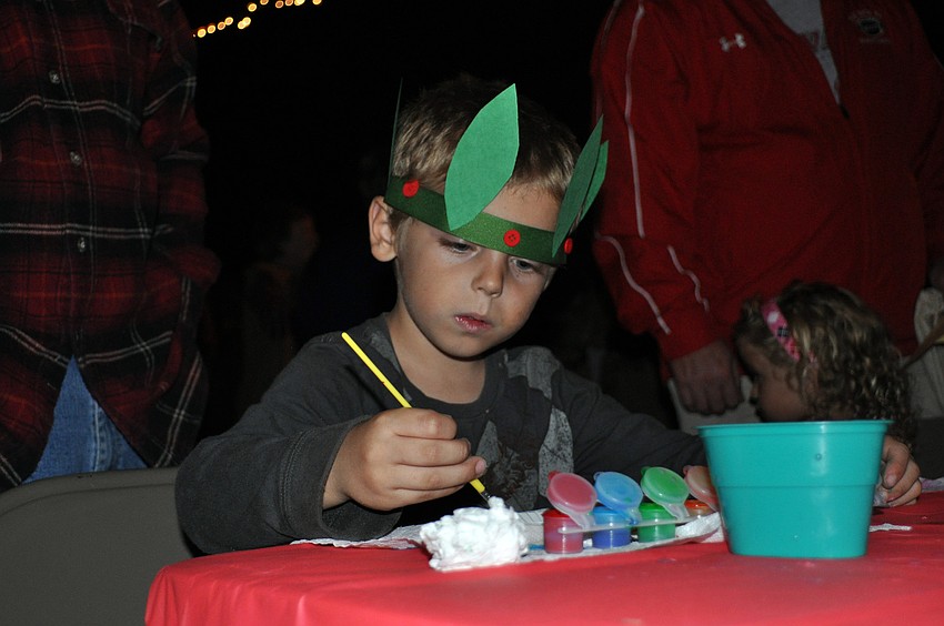 Five-year-old Jayden Jennings carefully painted a glass butterfly.