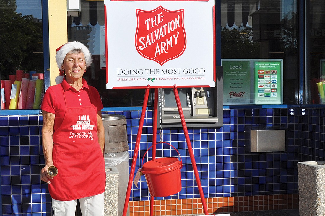 Jane Boehme, of the Longboat Key Garden Club, rings the bell for the Salvation Army Dec. 4.
