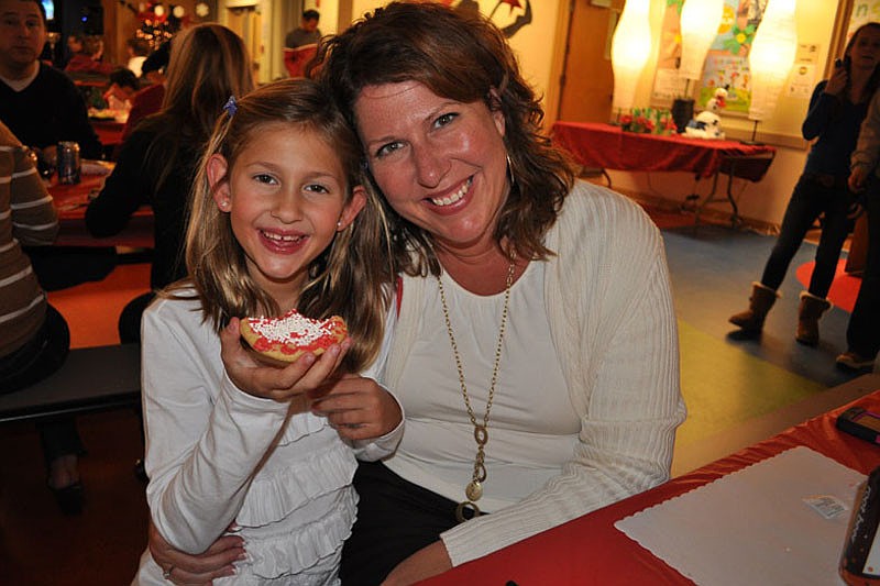 Caroline Pope enjoyed dinner with her mom, Denise, and brothers, Wiliam and Andrew, not pictured, while her dad took Santa pictures.