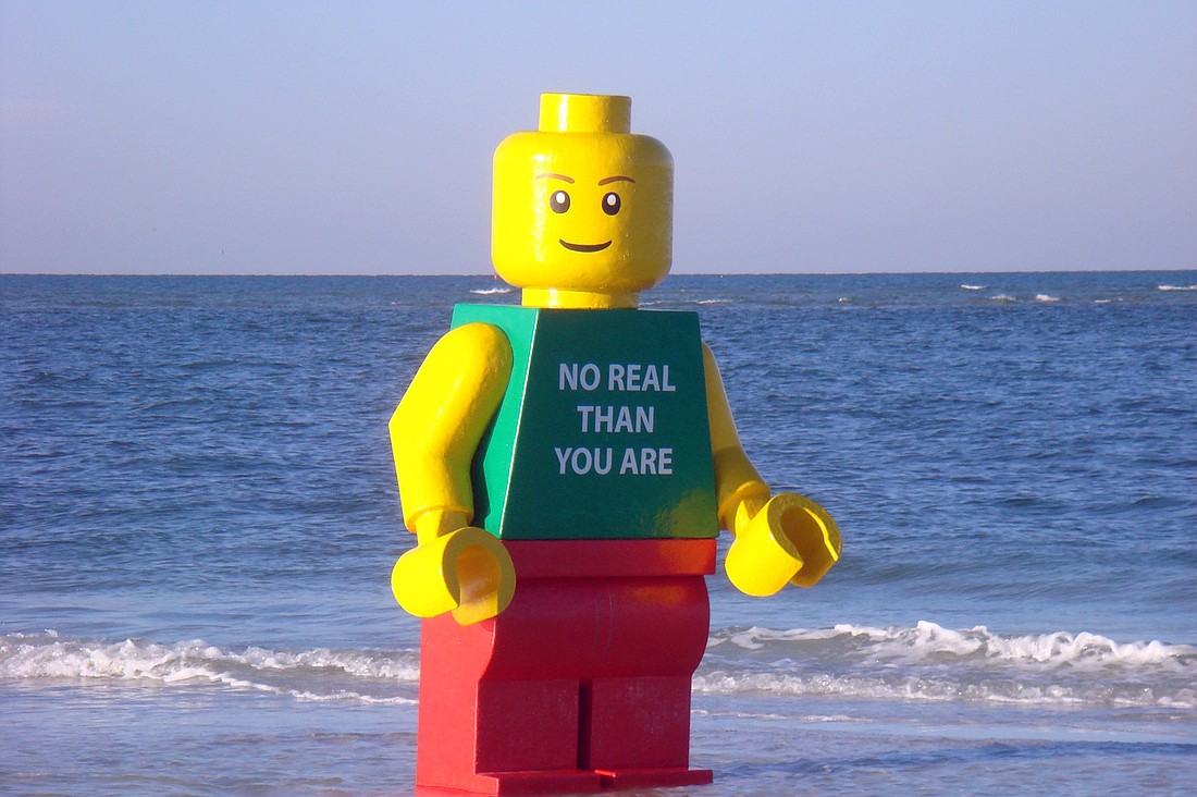 The item notes that Legoman "washed ashore on FloridaÃ¢â‚¬â„¢s Siesta Key in October," with the words, "No Real Than You Are," printed on its front.