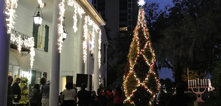 Families and friends of Selby Gardens gathered Thursday for the bromeliad tree lighting just outside the Payne Mansion.