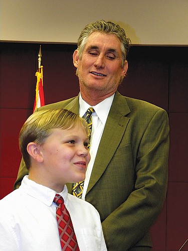 Josh Kroepfl, 9, helps sing Ã¢â‚¬Å“Happy BirthdayÃ¢â‚¬Â to Sarasota County Commissioner Jon Thaxton. Photo by Norman Schimmel.
