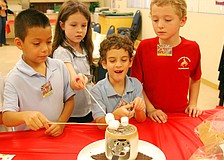 Devan Rojas, left, Hayley Dragon, Chris Maddiesquivel and Keaton Bruder enjoyed making s'mores.