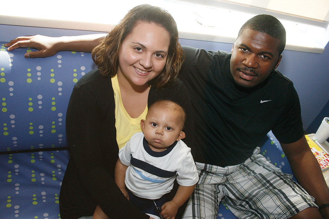 Ivette and Anthony Littlejohn surround their son, Adrian, with positive energy as he undergoes chemotherapy.