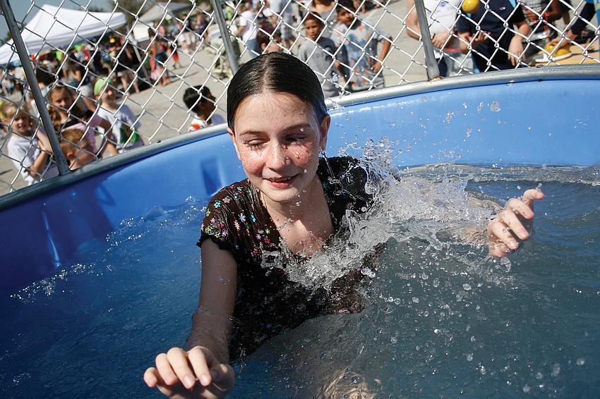 Cate Eschmann, 12, didn't mind getting wet in the dunk tank at McNeal Elementary's Winter Carnival. Published March 3, 2011.