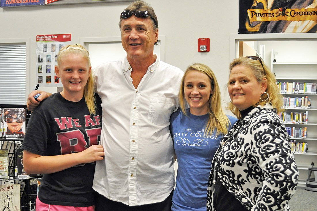Braden River High senior Brittany Jaco celebrated her accomplishment with her younger sister, Madison, left, and parents David and Wynna.