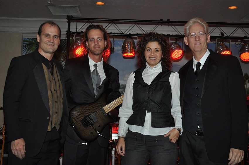 Brandon Sommers, Willy D. Sloan, Jennifer Real and Curtis Weeks of Chameleon performed song covers for the party