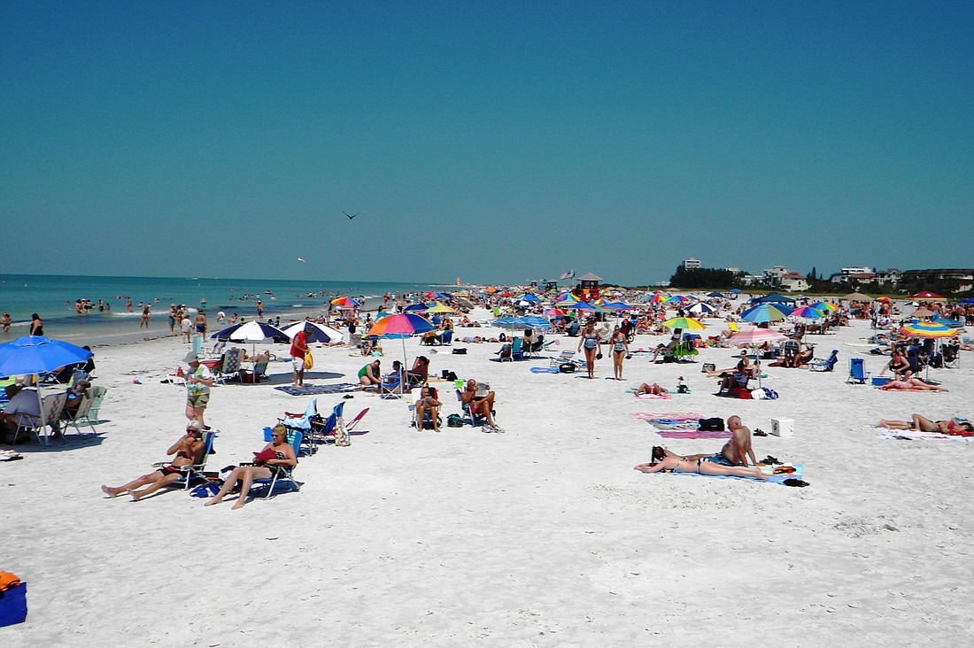 Visitors coming to Sarasota County to see the top beach in the country in 2011 helped push county tourism tax collections to a level not seen in several years. Photo by Norman Schimmel