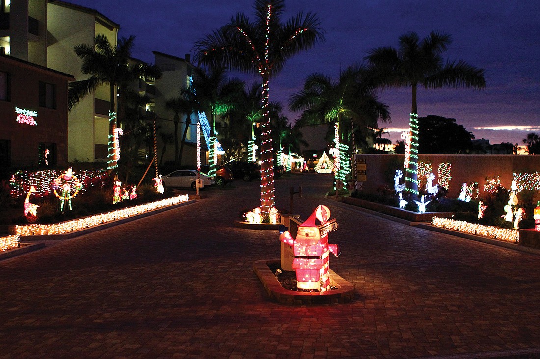 Siesta Dunes, at 6200 Midnight Pass Road, offers a feast of holiday lights for residents and passersby. Its decorations wowed the judges, too, during the annual Siesta Key Condominium Association Condo Lighting Contest.