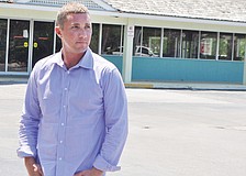 In April, developer Brian Kenney, with Juliani Kenney Investment Capital LLC, stood in front of Whitney Beach Plaza, which was 85% vacant at the time.