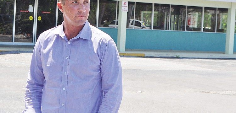 In April, developer Brian Kenney, with Juliani Kenney Investment Capital LLC, stood in front of Whitney Beach Plaza, which was 85% vacant at the time.