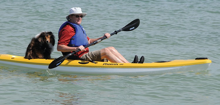 Barry Sullivan takes a trip on his new kayak with his dog, Justice.