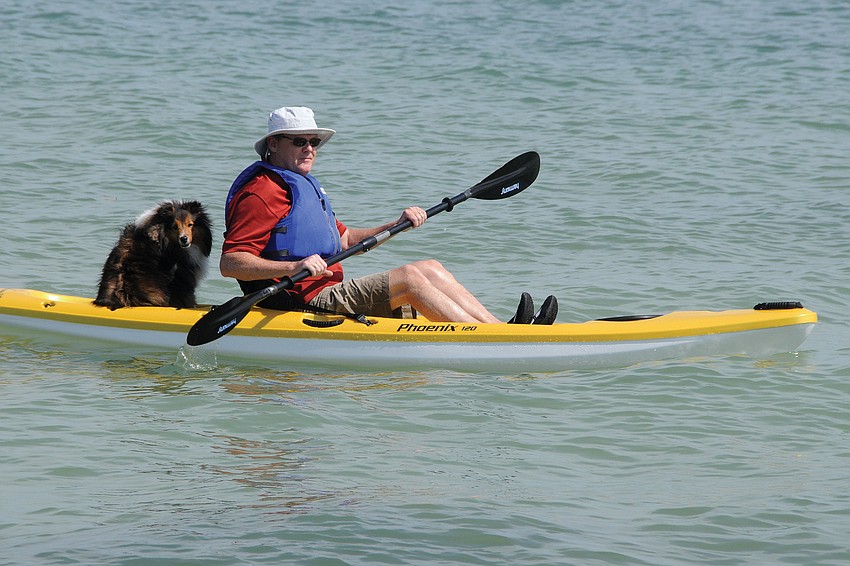 Barry Sullivan takes a trip on his new kayak with his dog, Justice.