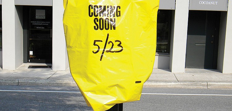 A parking meter stood bagged in downtown Sarasota, with paid parking set to begin May 23.
