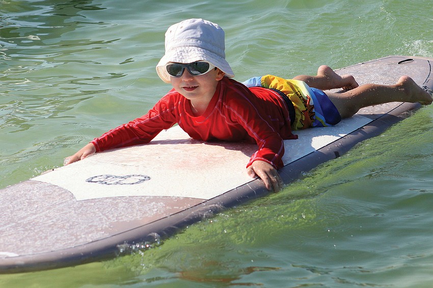 Harrison Troyan, 4, was among about 80 youngsters who participated Sept. 17 in the Hang Ten for Autism event on the public beach.