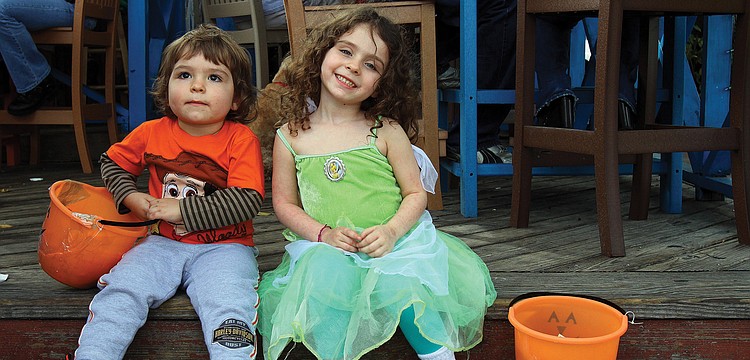 August, 2, and April, 4, Turner, took a few minutes to relax on the steps of the Siesta Key Oyster Bar during the Villageâ€™s annual Safe Treats Halloween event.