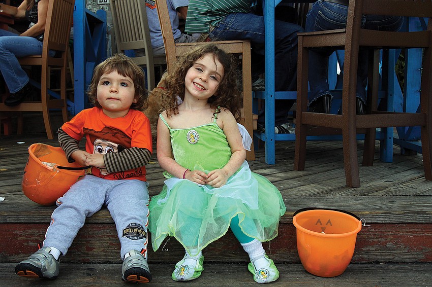 August, 2, and April, 4, Turner, took a few minutes to relax on the steps of the Siesta Key Oyster Bar during the Villageâ€™s annual Safe Treats Halloween event.