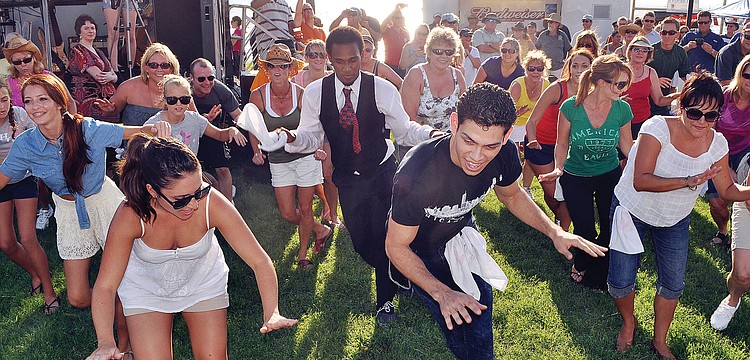The members of the flash mob performed during a break between sets in August at First Friday Fest.