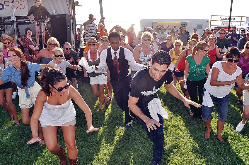 The members of the flash mob performed during a break between sets in August at First Friday Fest.