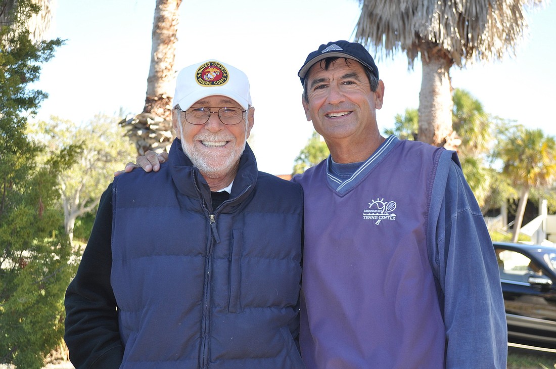 Joe Salvino and Tennis Pro David Sparks watch tennis matches from the sidelines at the Longboat Key Public Tennis Center on Tuesday, Jan. 3.