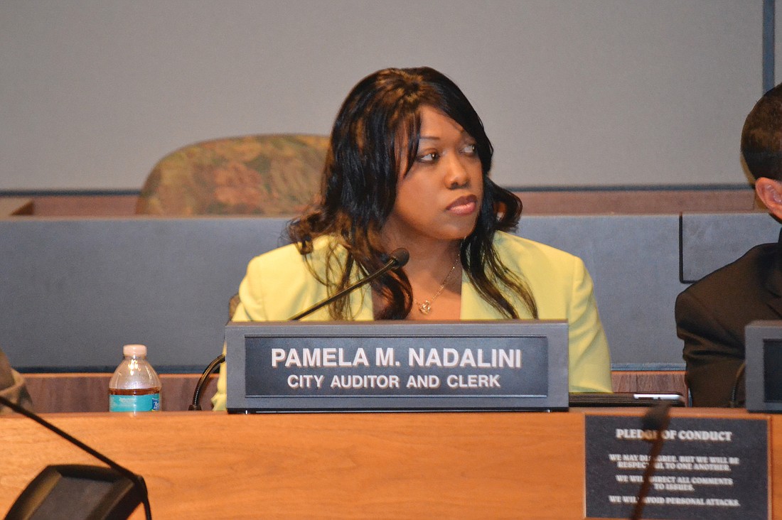 City Auditor and Clerk Pamela NadaliniÃ¢â‚¬â„¢s scheduling of a meeting for Friday was called into question by the City Commission.