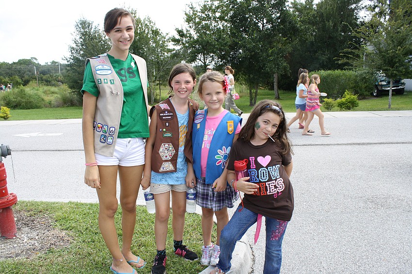 Fourteen-year-old Raven Peters has been a Girl Scout for ten years.  She poses with Olivia Bailey, Faith Chaney and Emma Tetrault.