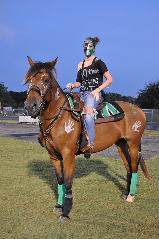 Libby Spence and Kimber ran out with the football team.
