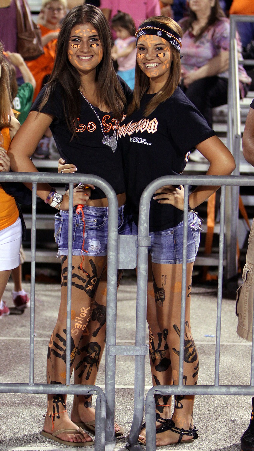 Gabriella Zaccari and Roxanne Gingerich got all dressed and painted up in orange and black for the homecoming game Friday, Oct. 14, at Cleland Stadium.