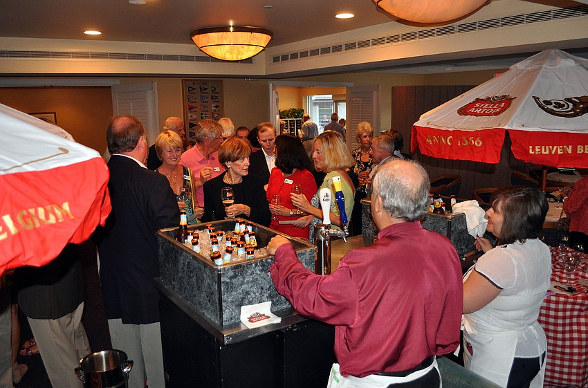 Members of BKYC stand around trying out different Belgian beers and rated them, Saturday, Oct. 22 at Bird Key Yacht Club.