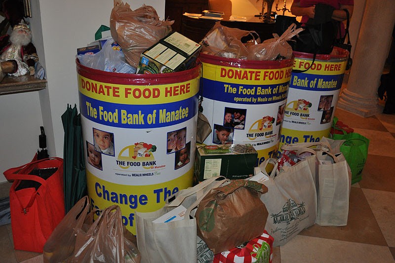 Guests brought canned goods to benefit the Food Bank of Manatee.