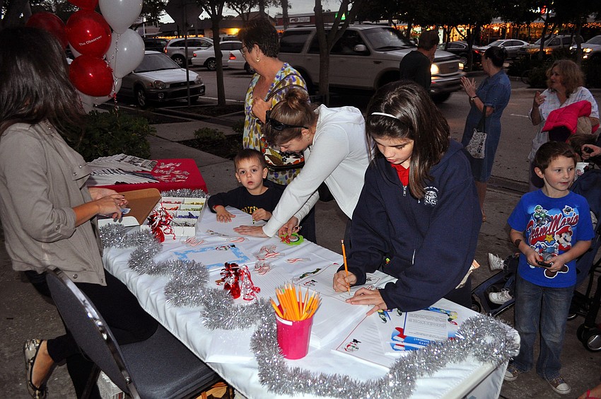 Kids wrote and drew letters for Santa at the Observerâ€™s table, Friday, November 9, during Southside Stroll.
