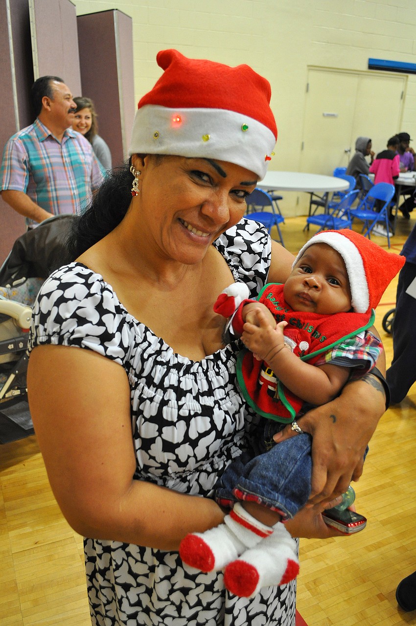 Isabelle Santana holds her grandson, Nehemiah Mendez, 3 mos.