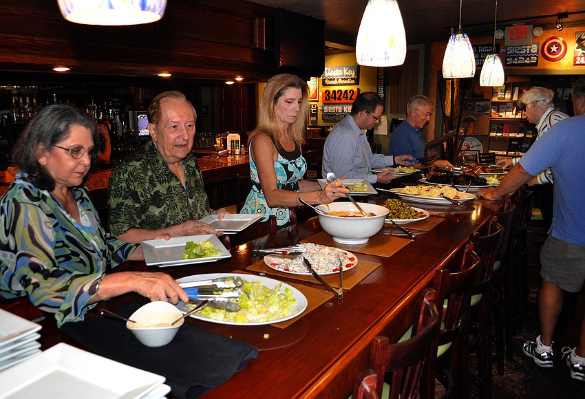 Members of YES lined up to get their lunch Tuesday, Sept. 6 during the YES luncheon at Claytonâ€™s Siesta Grille on Siesta Key.