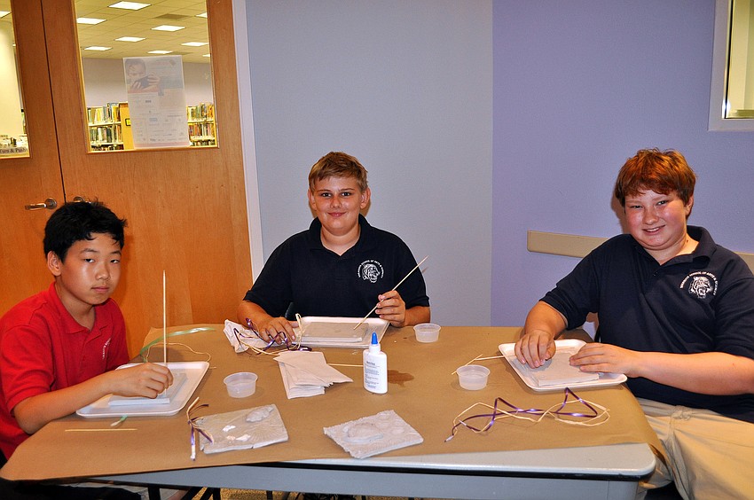 Phillip Namgoong, 11, Logan Track, 11, and Christopher Bixler, 12